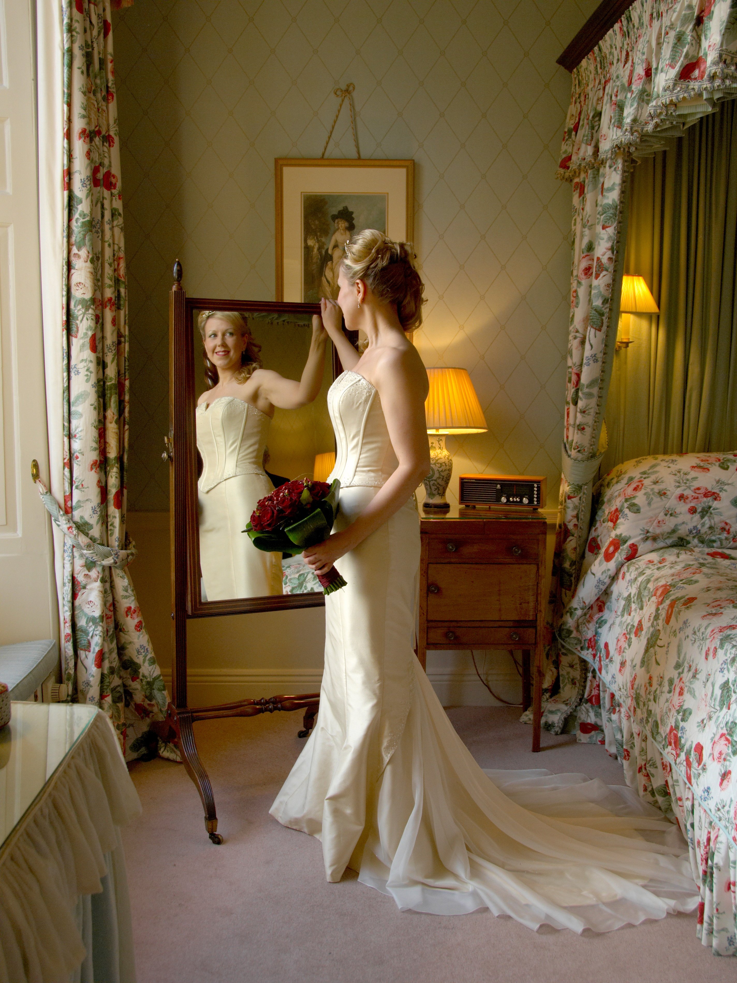 Bride in front of mirror at Middlethorpe Hall