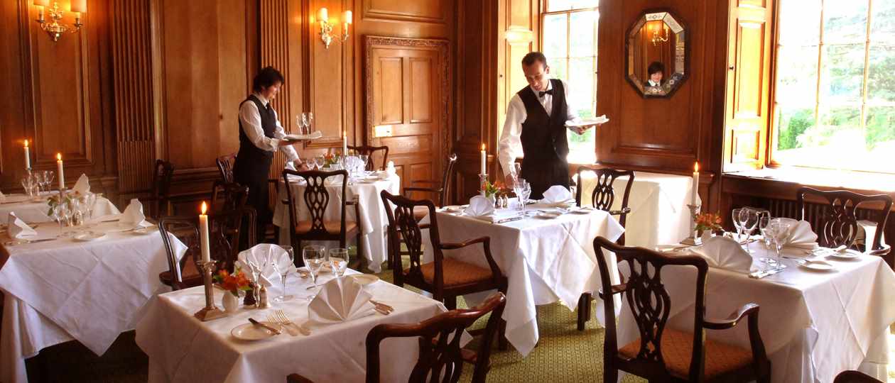 Waiters setting up in Oak Dining Room at Middlethorpe Hall
