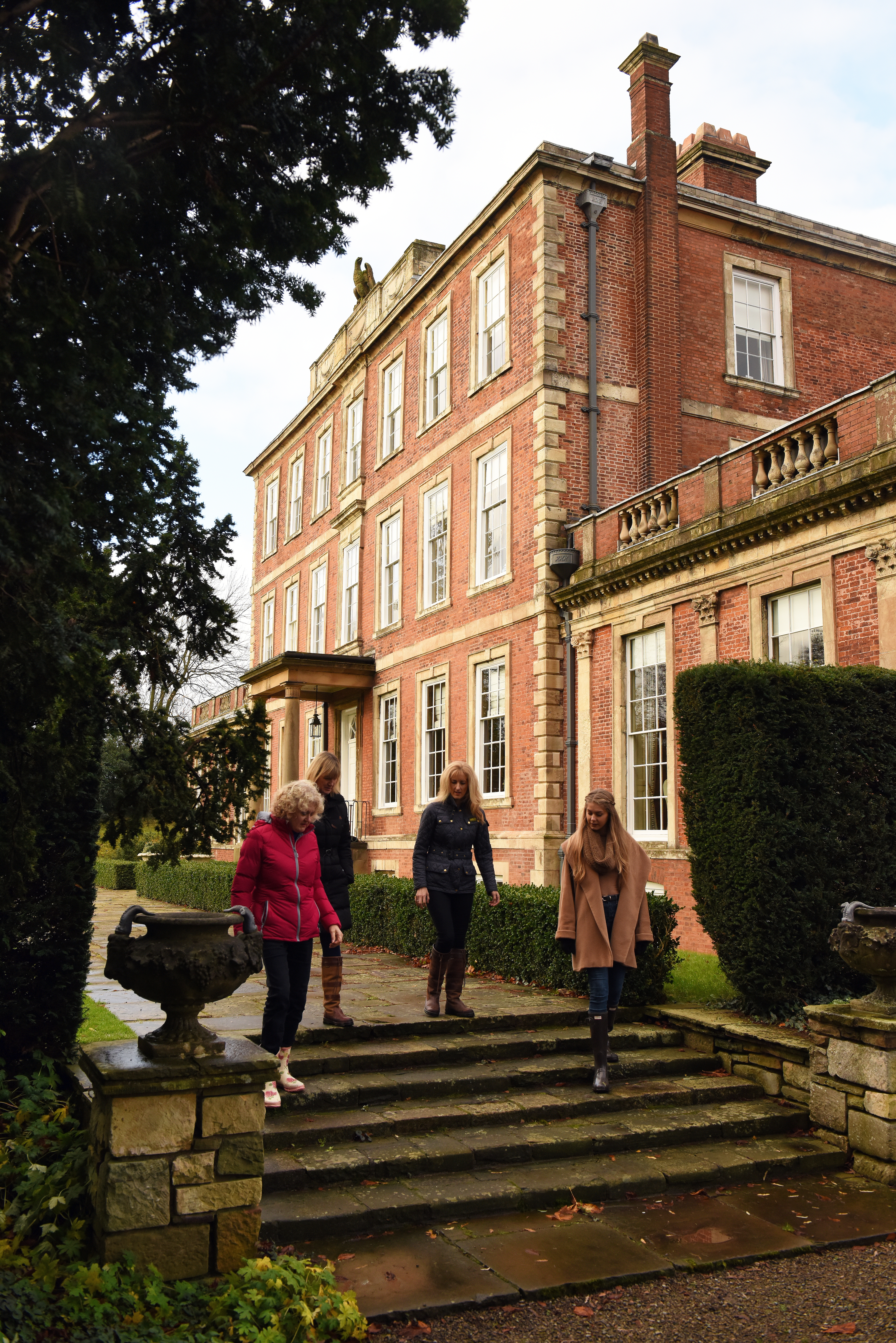 Guests on south terrace at Middlethorpe Hall in autumn