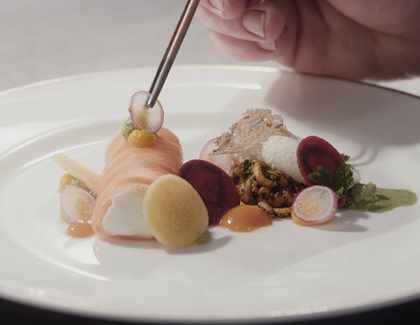 Finishing touch to food dish at Middlethorpe Hall Finishing touch to food dish at Middlethorpe Hall