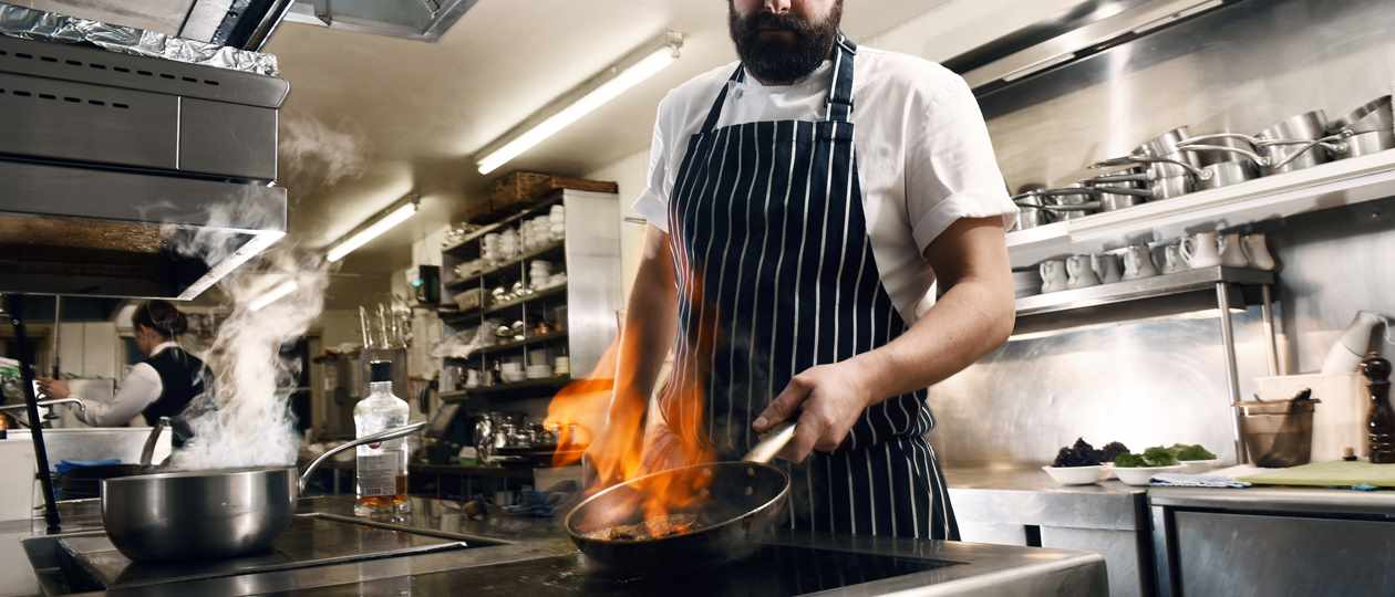 Head Chef Ashley Binder with flambe